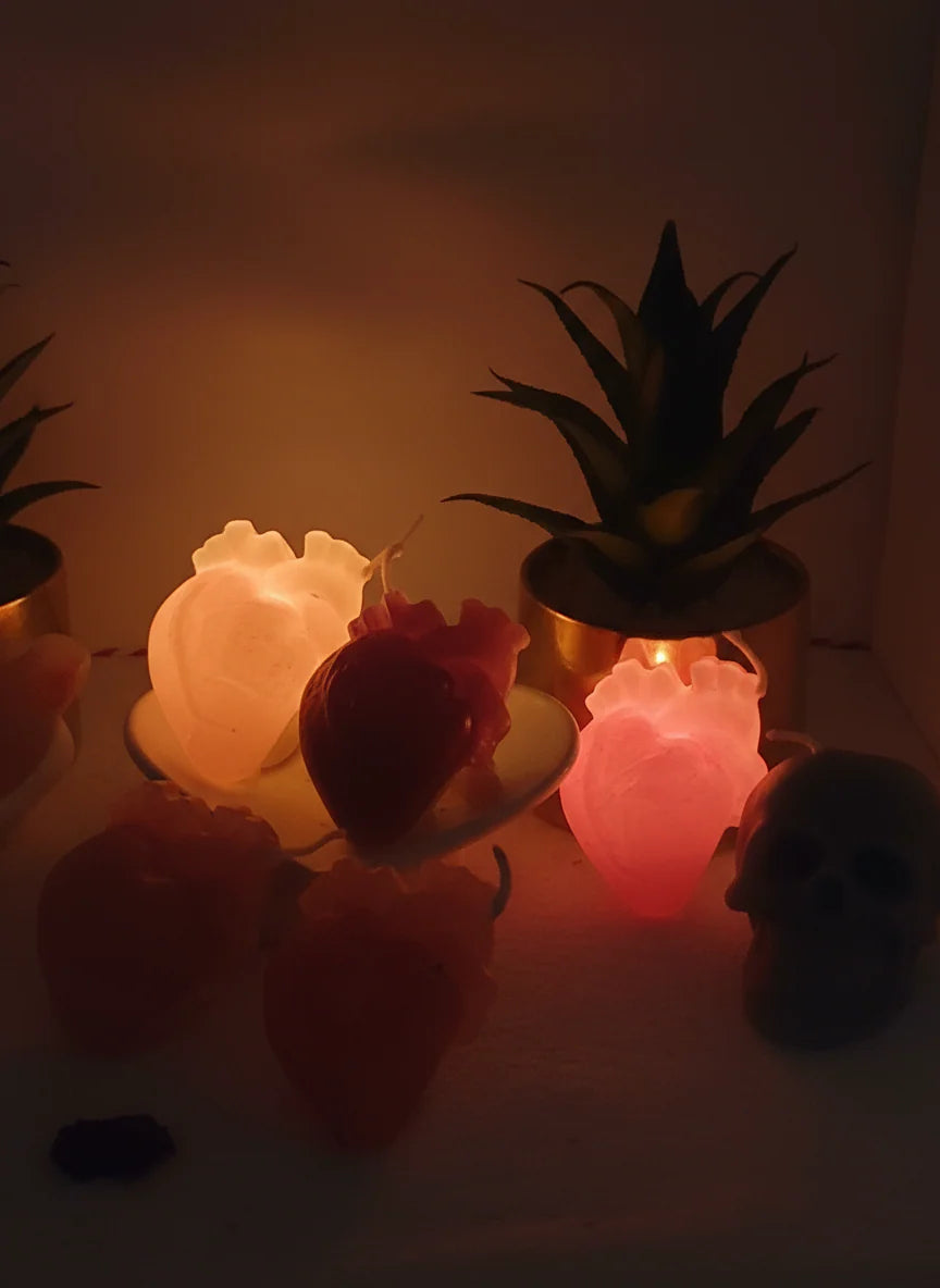 Heart multicolor arrangement  in dark setting with skull candle